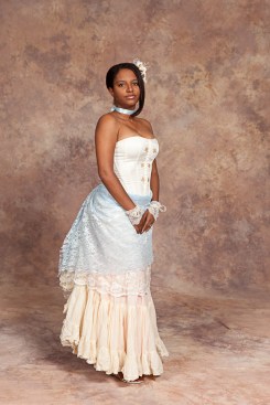 Cream corset, blue and cream lace bustle, cream skirt, lace cuffs, cream-pink flower fascinator, blue ribbon choker